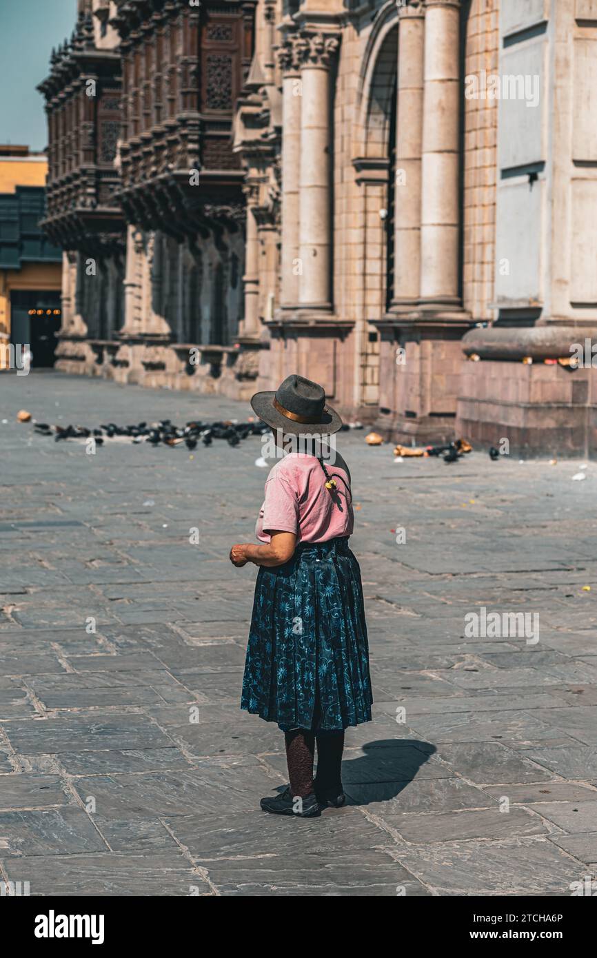 Plaza Mayor de Lima, historical city center, elderly lady in traditional clothing from behind, Lima, Peru, 2023 Stock Photo