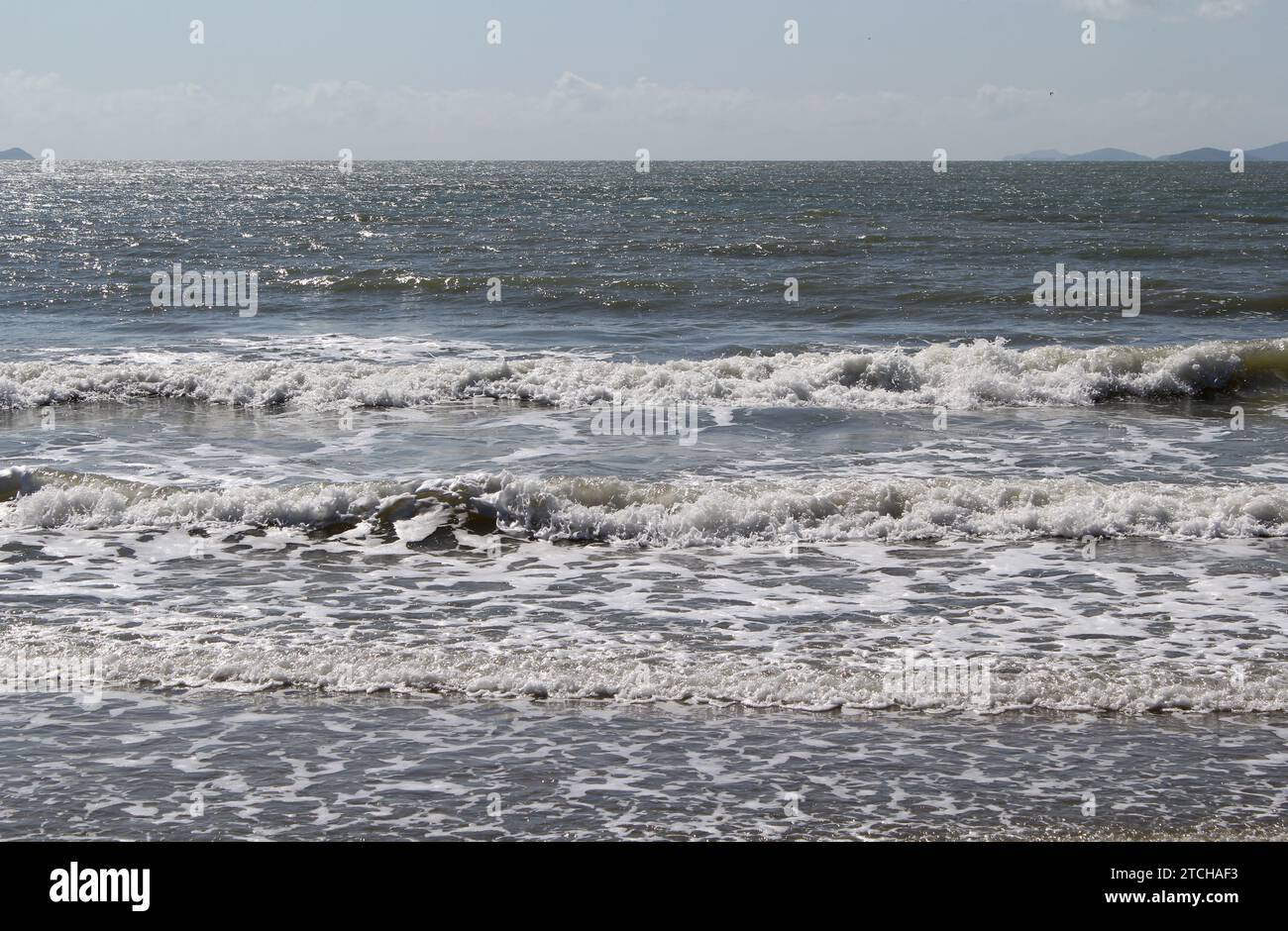 Waves breaking in the ocean at a beach Stock Photo - Alamy
