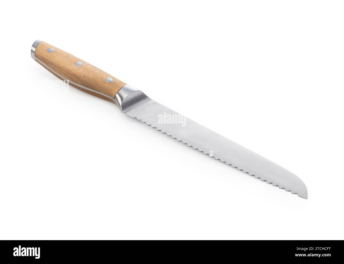 Bread knife with wooden handle placed on white background. Stock Photo