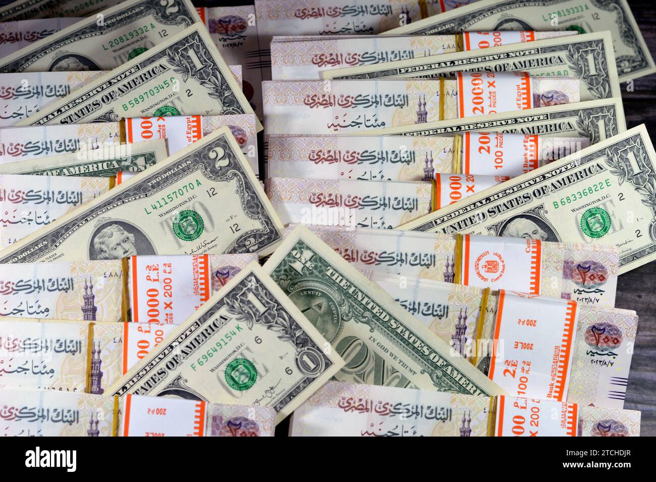 piles-and-stacks-of-egypt-money-thousands-of-pounds-currency-banknotes-bills-of-200-egp-le-egyptian-money-exchange-rate-and-usa-american-dollars-ban-2TCHDJR.jpg