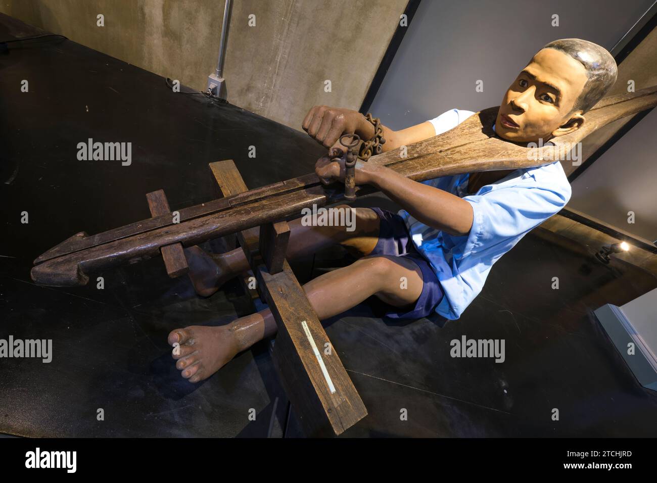 A display of a typical prisoner, locked in a Tangok, a bamboo collar