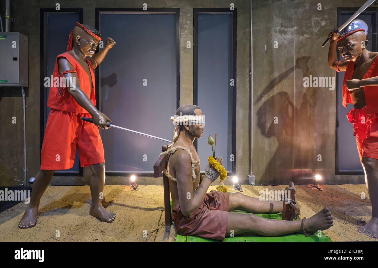 A display of an execution by sword, a beheading. The prisoner is blindfolded, a flower offering is presented and then the prisoner is killed. At the C Stock Photo