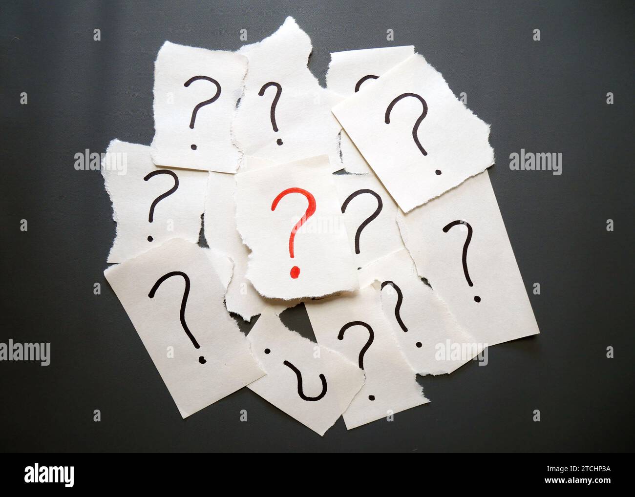 Torn paper showing question mark symbol on yellow background with copy ...