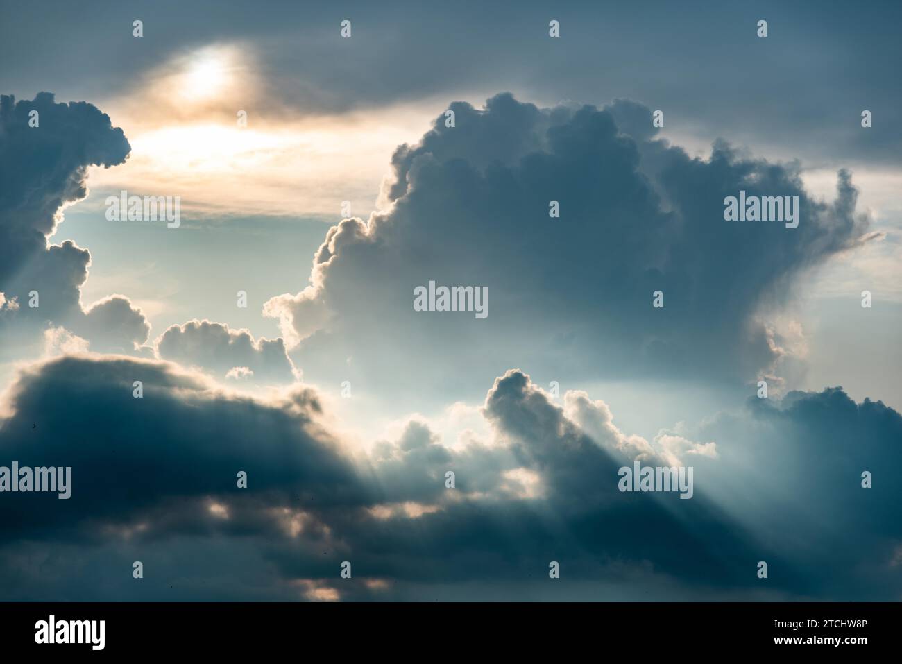 Dramatic sky, light from heaven. Sun and clouds. Background Stock Photo