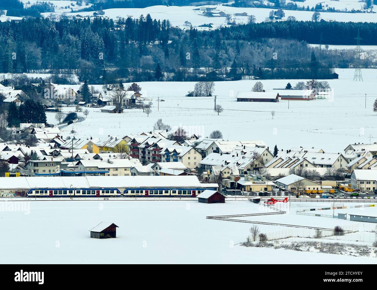 Drone photo of the Bavarian landscape with a BRB regional train and a rescue helicopter at a McDonalds restaurant in the morning in Marktoberdorf, Germany, Nov 29, 2023.  © Peter Schatz / Alamy Stock Photos Stock Photo