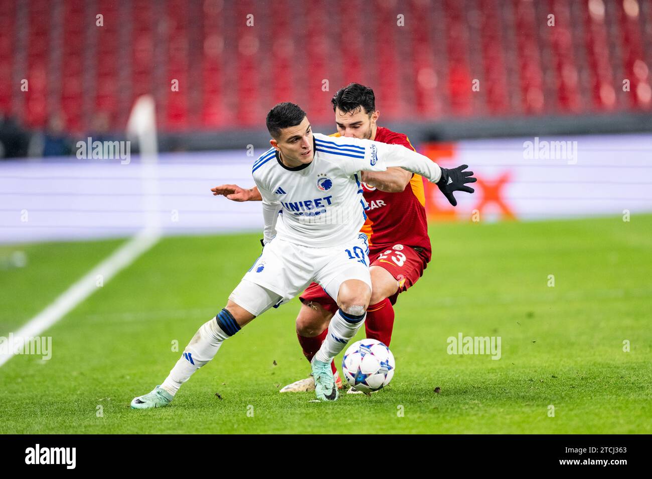 Copenhagen, Denmark. 12th Dec, 2023. Mohamed Elyounoussi (10) of FC Copenhagen and Kaan Ayhan (23) of Galatasaray seen during the UEFA Champions League match between FC Copenhagen and Galatasaray at Parken in Copenhagen. (Photo Credit: Gonzales Photo/Alamy Live News Stock Photo