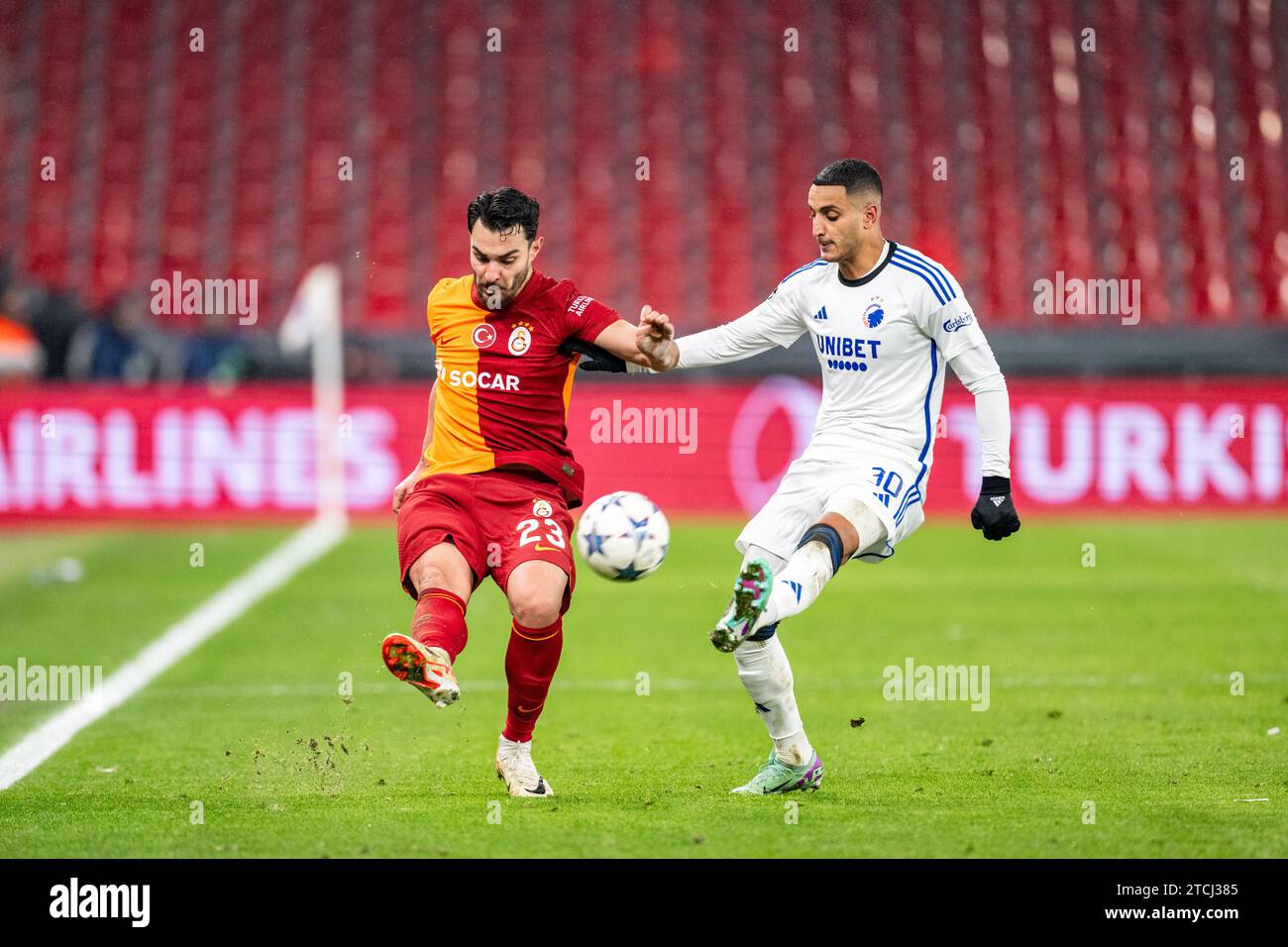 Copenhagen, Denmark. 12th Dec, 2023. Kaan Ayhan (23) of Galatasaray and Elias Achouri (30) of FC Copenhagen seen during the UEFA Champions League match between FC Copenhagen and Galatasaray at Parken in Copenhagen. (Photo Credit: Gonzales Photo/Alamy Live News Stock Photo