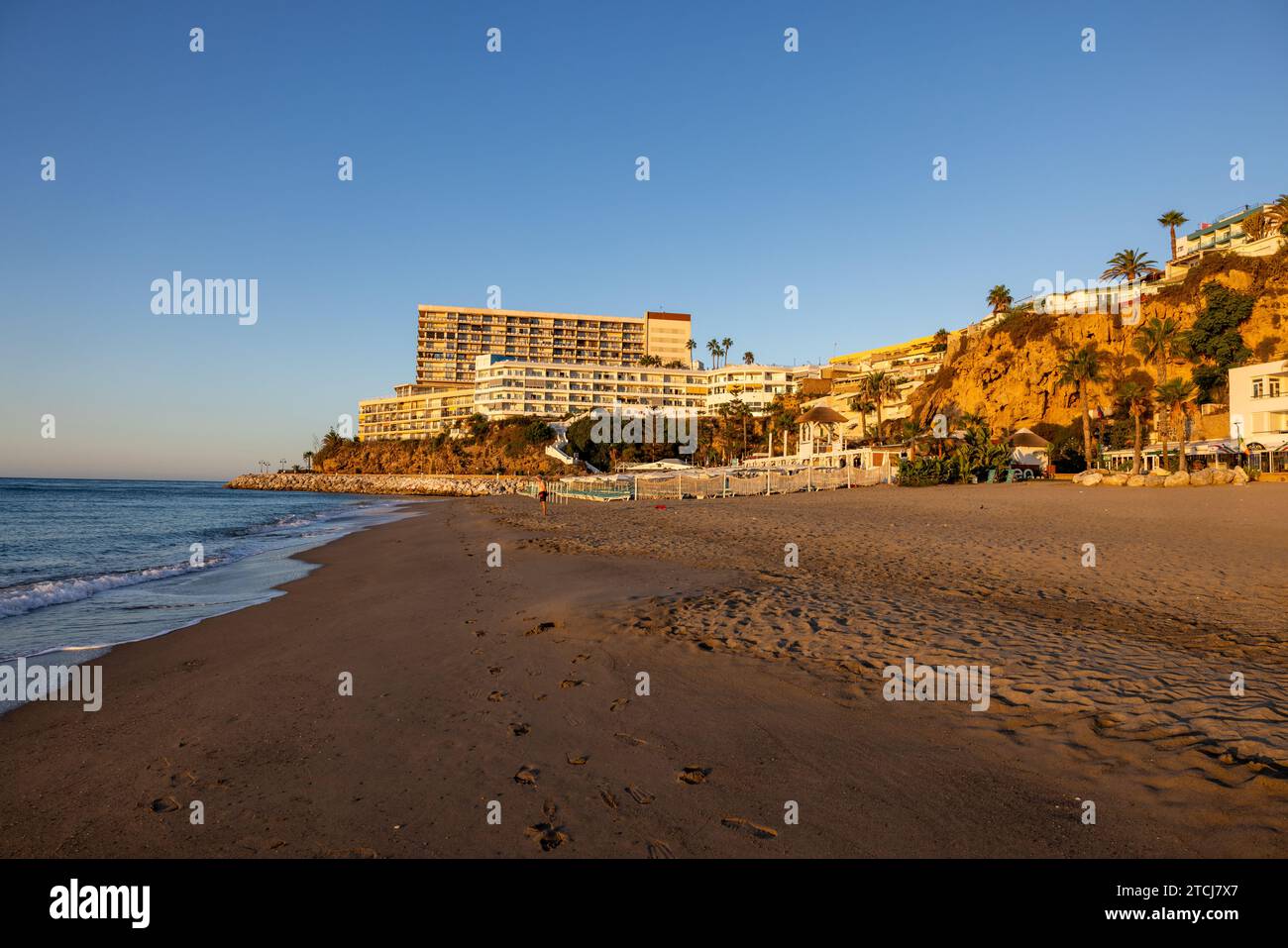 View of Bajondillo Beach and hotels in Torremolinos at sunrise. Costa del Sol, Spain. Stock Photo