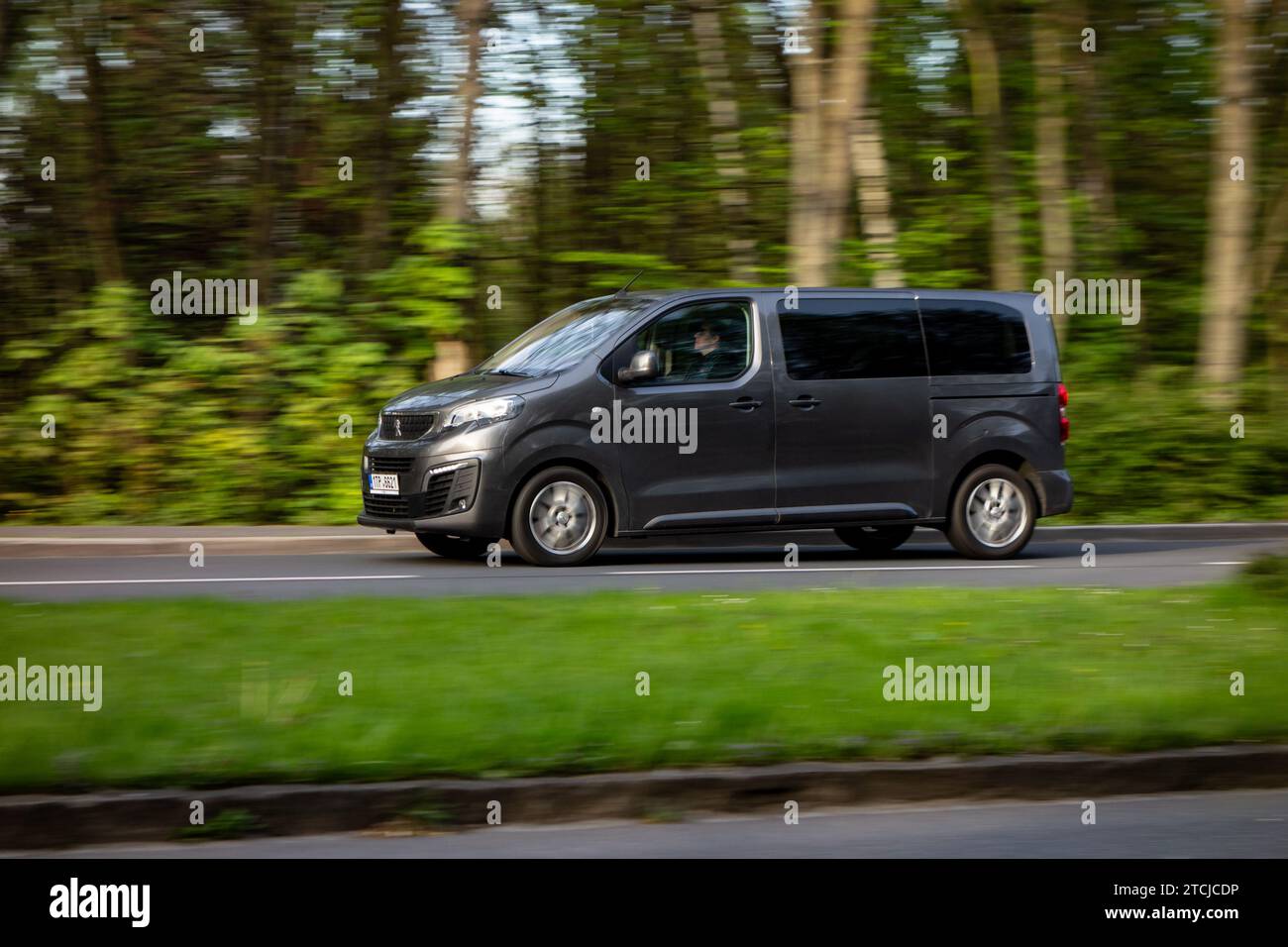 HAVIROV, CZECH REPUBLIC - MAY 4, 2023: Peugeot Expert Combi minivan with strong motion blur effect Stock Photo