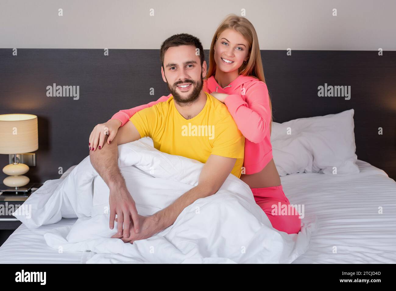 Young lovely couple have fun in a bed Stock Photo - Alamy