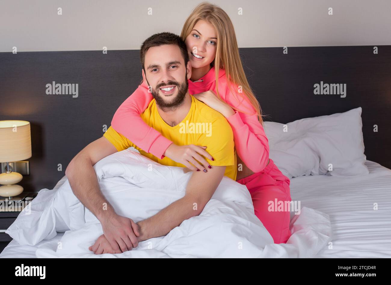 Young lovely couple have fun in a bed Stock Photo - Alamy