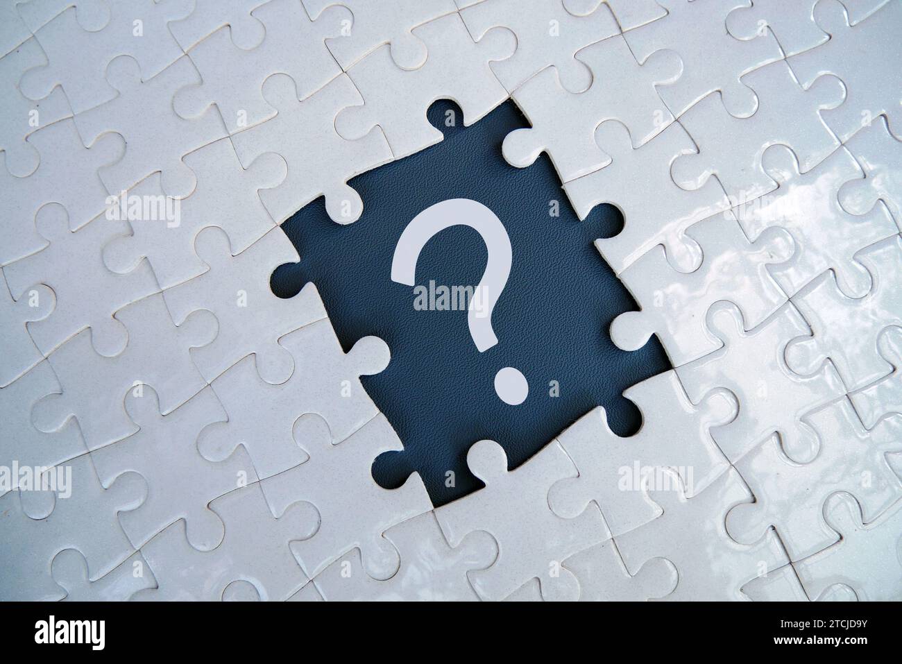 Question mark on jigsaw puzzle with missing piece. Concept of question