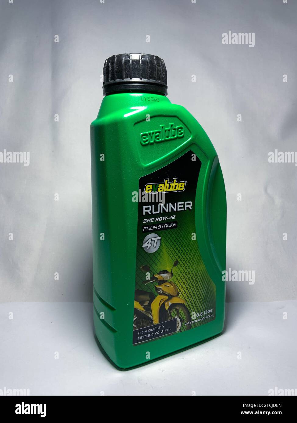 Surakarta, Indonesia - November 20, 2023 : Evalube Runner motor oil, high quality motorcycle oil four stroke 4T 800ml. Evalube green bottle packaging. Stock Photo