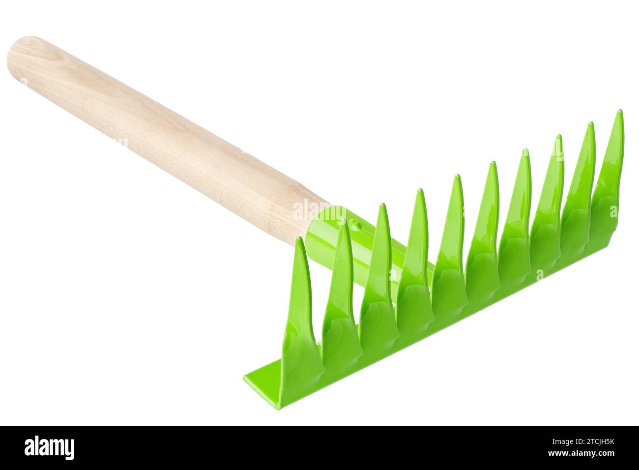 Green metal rake with wooden handle, garden tool, isolated on white background Stock Photo