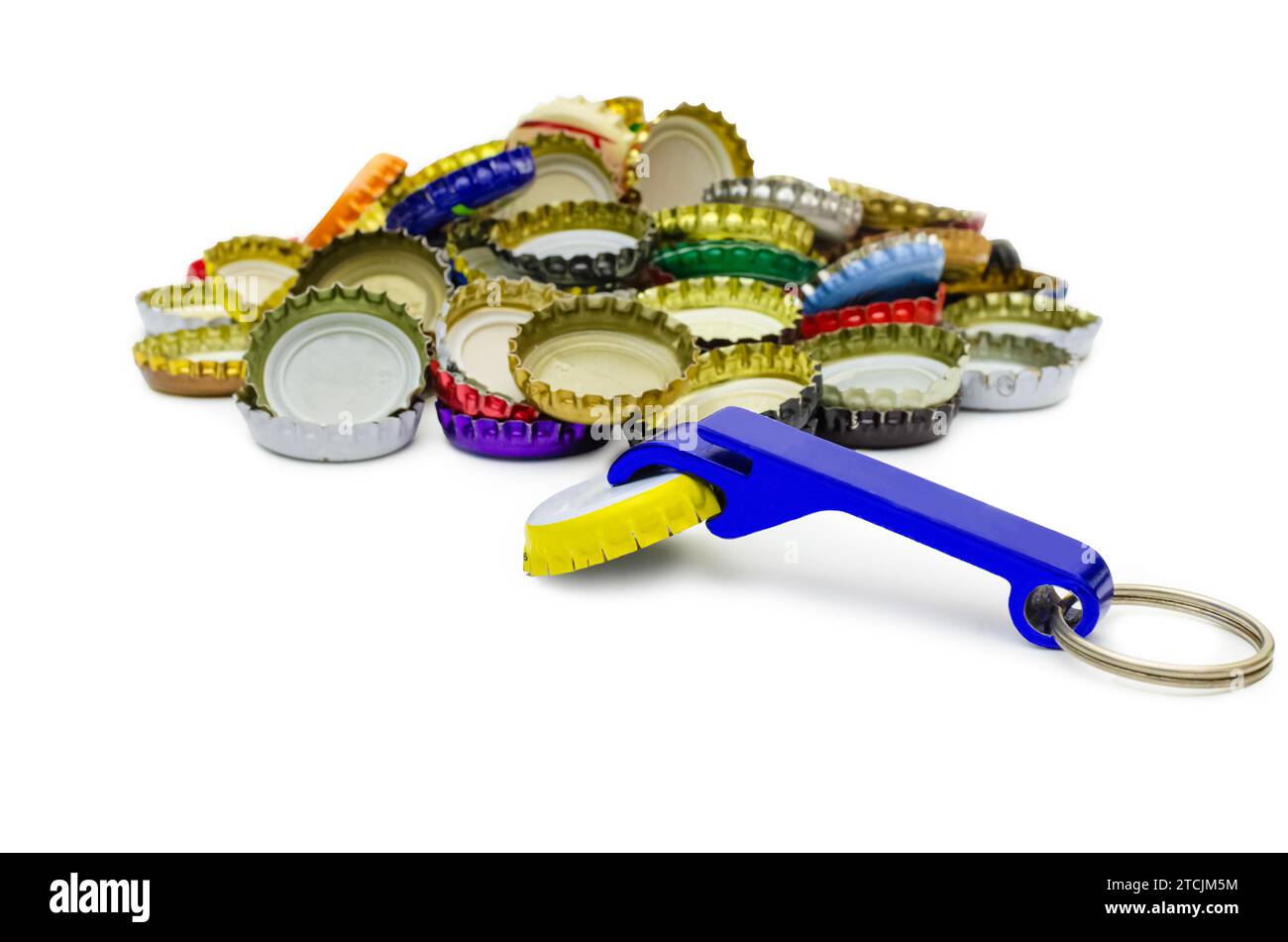 Keychain with bottle opener, blue steel chain, pile of beer caps on ...