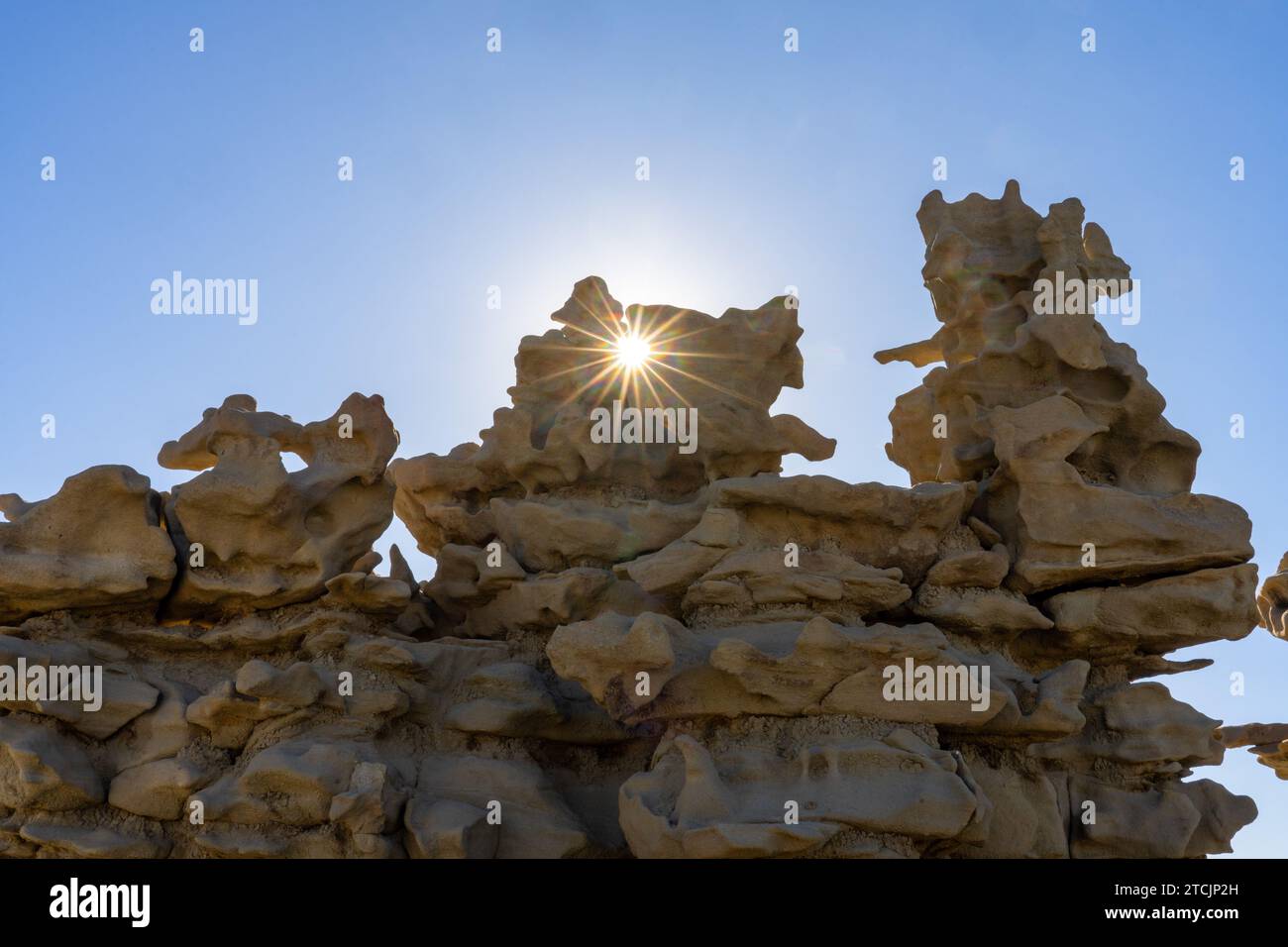 A sunburst through the fantastically eroded sandstone formations in the Fantasy Canyon Recreation Site, near Vernal, Utah. Stock Photo