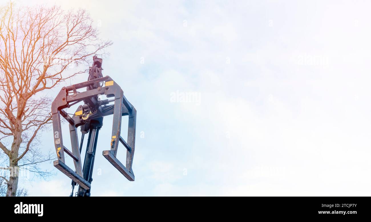 Dropside flatbed HIAB crane lorry with brick grab attachment deliver materials on construction site and offloading them Stock Photo