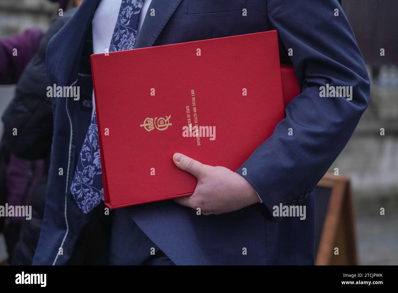 Nhs Red Box London UK. 13 December 2023. An NHS health minister carries a red ...