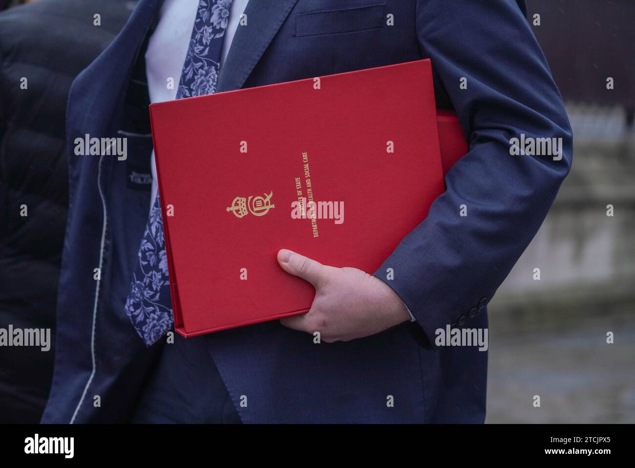 Nhs Red Box London UK. 13 December 2023. An NHS health minister carries a red ...