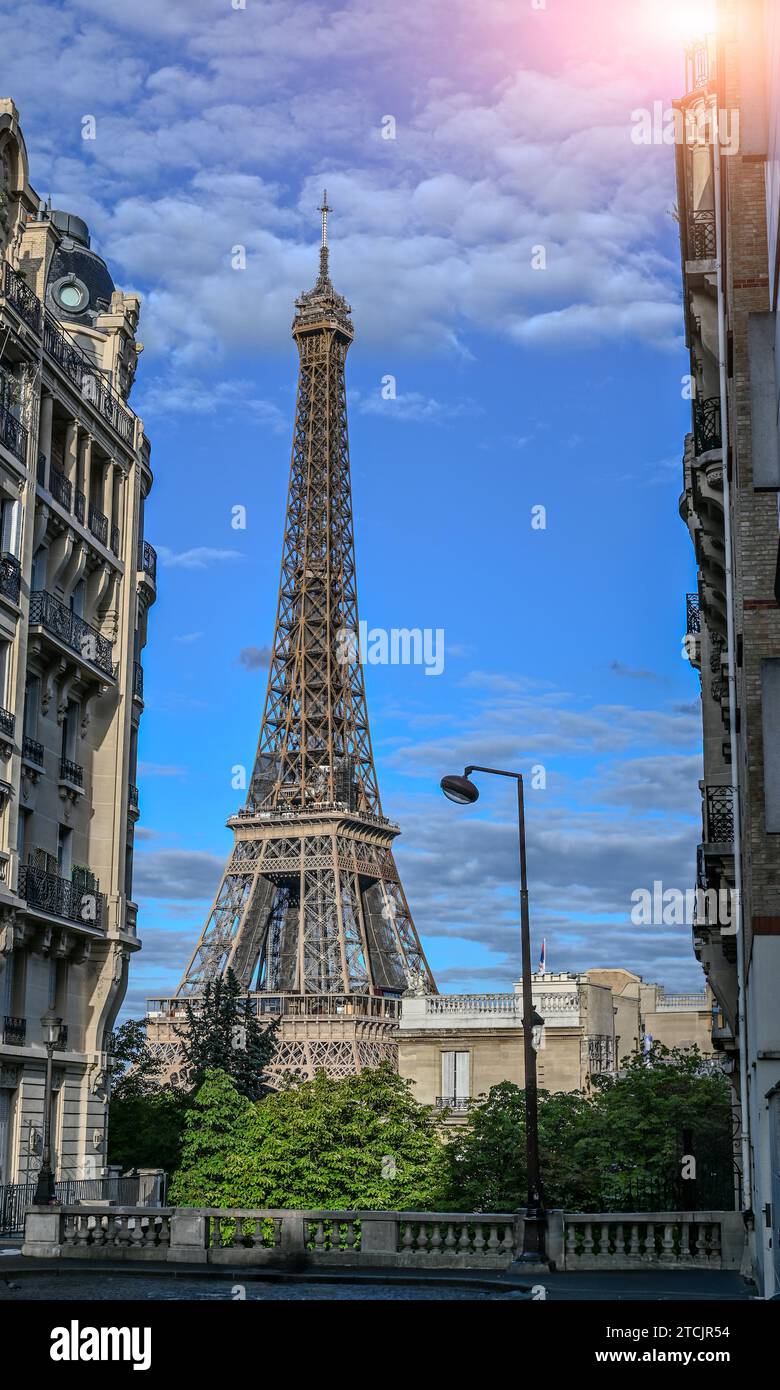 Paris, France July 1, 2022. The Eiffel Tower seen from one of the most sought after points: the Avenue de Camoens. People busy taking photos, beautifu Stock Photo
