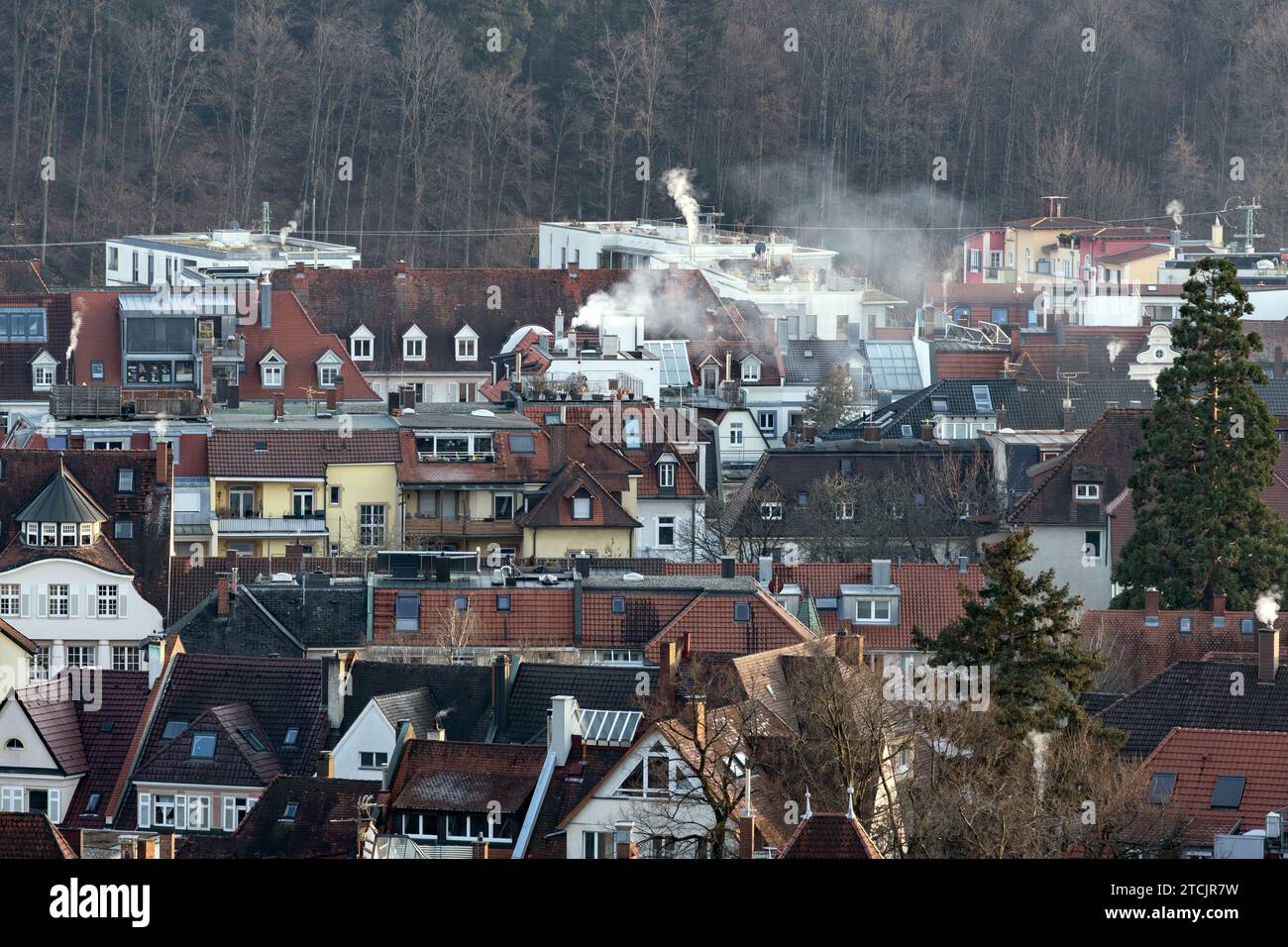 Roof landscape in Freiburg with smoking chimneys Stock Photo