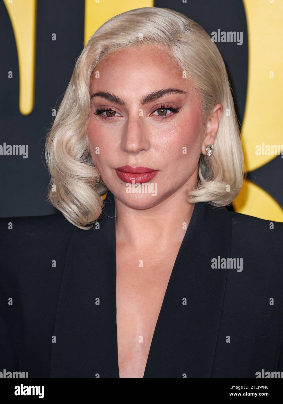 Los Angeles, United States. 12th Dec, 2023. LOS ANGELES, CALIFORNIA, USA - DECEMBER 12: American singer, songwriter and actress Lady Gaga (Stefani Joanne Angelina Germanotta) wearing an Alexander McQueen suit arrives at the Los Angeles Special Screening Of Netflix's 'Maestro' held at the Academy Museum of Motion Pictures on December 12, 2023 in Los Angeles, California, United States. (Photo by Xavier Collin/Image Press Agency) Credit: Image Press Agency/Alamy Live News Stock Photo