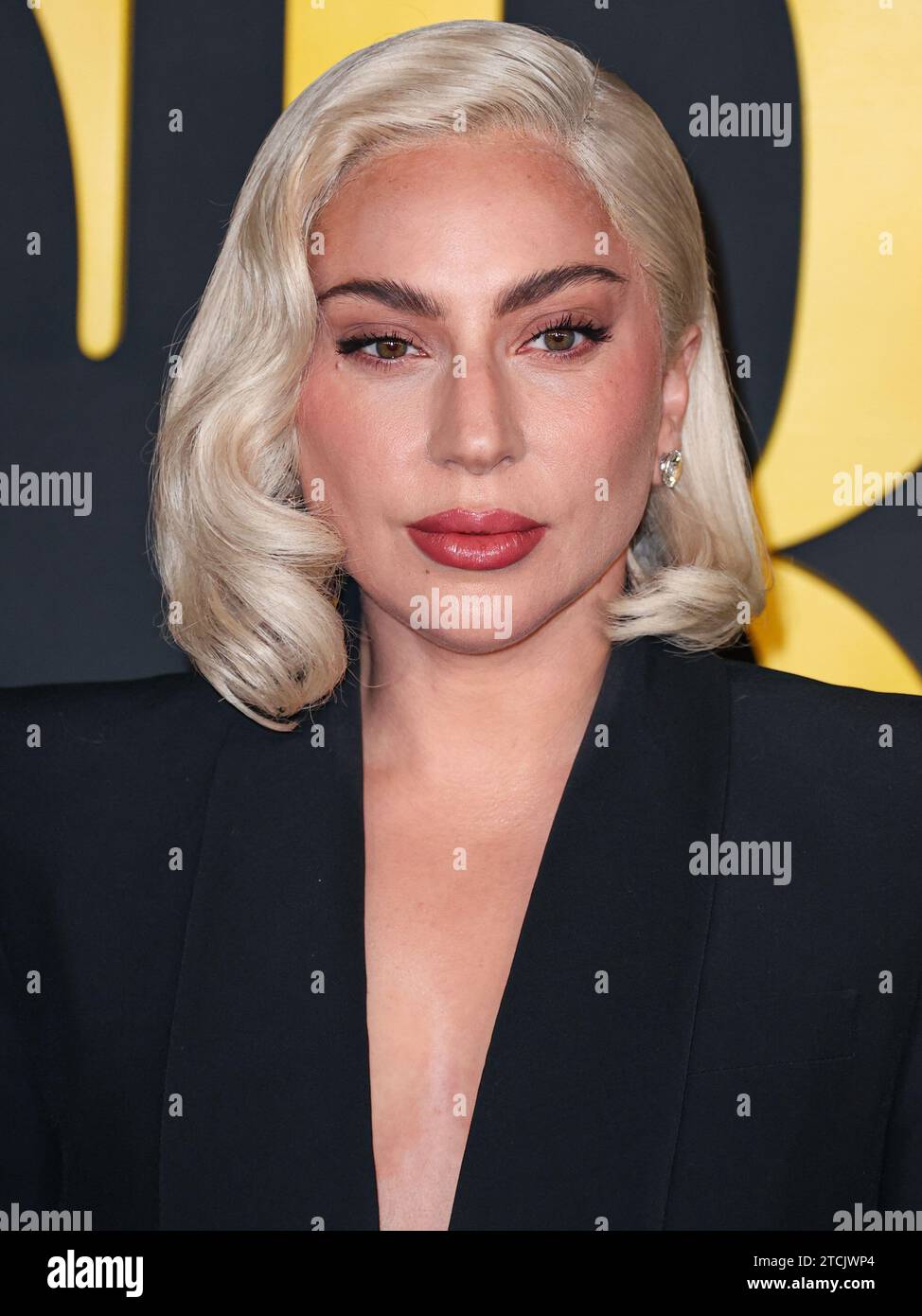 Los Angeles, United States. 12th Dec, 2023. LOS ANGELES, CALIFORNIA, USA - DECEMBER 12: American singer, songwriter and actress Lady Gaga (Stefani Joanne Angelina Germanotta) wearing an Alexander McQueen suit arrives at the Los Angeles Special Screening Of Netflix's 'Maestro' held at the Academy Museum of Motion Pictures on December 12, 2023 in Los Angeles, California, United States. (Photo by Xavier Collin/Image Press Agency) Credit: Image Press Agency/Alamy Live News Stock Photo