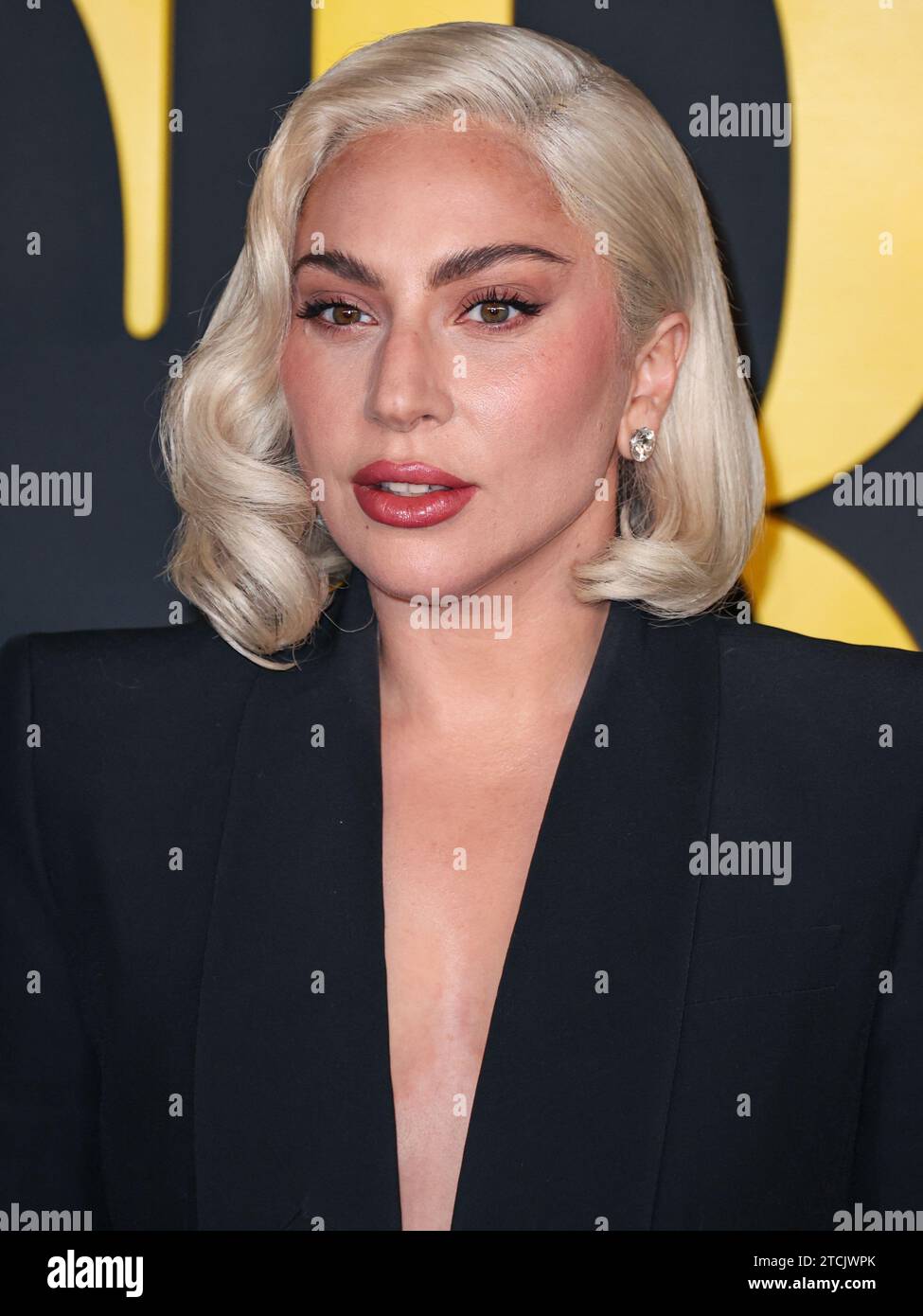 Los Angeles, United States. 12th Dec, 2023. LOS ANGELES, CALIFORNIA, USA - DECEMBER 12: American singer, songwriter and actress Lady Gaga (Stefani Joanne Angelina Germanotta) wearing an Alexander McQueen suit arrives at the Los Angeles Special Screening Of Netflix's 'Maestro' held at the Academy Museum of Motion Pictures on December 12, 2023 in Los Angeles, California, United States. (Photo by Xavier Collin/Image Press Agency) Credit: Image Press Agency/Alamy Live News Stock Photo