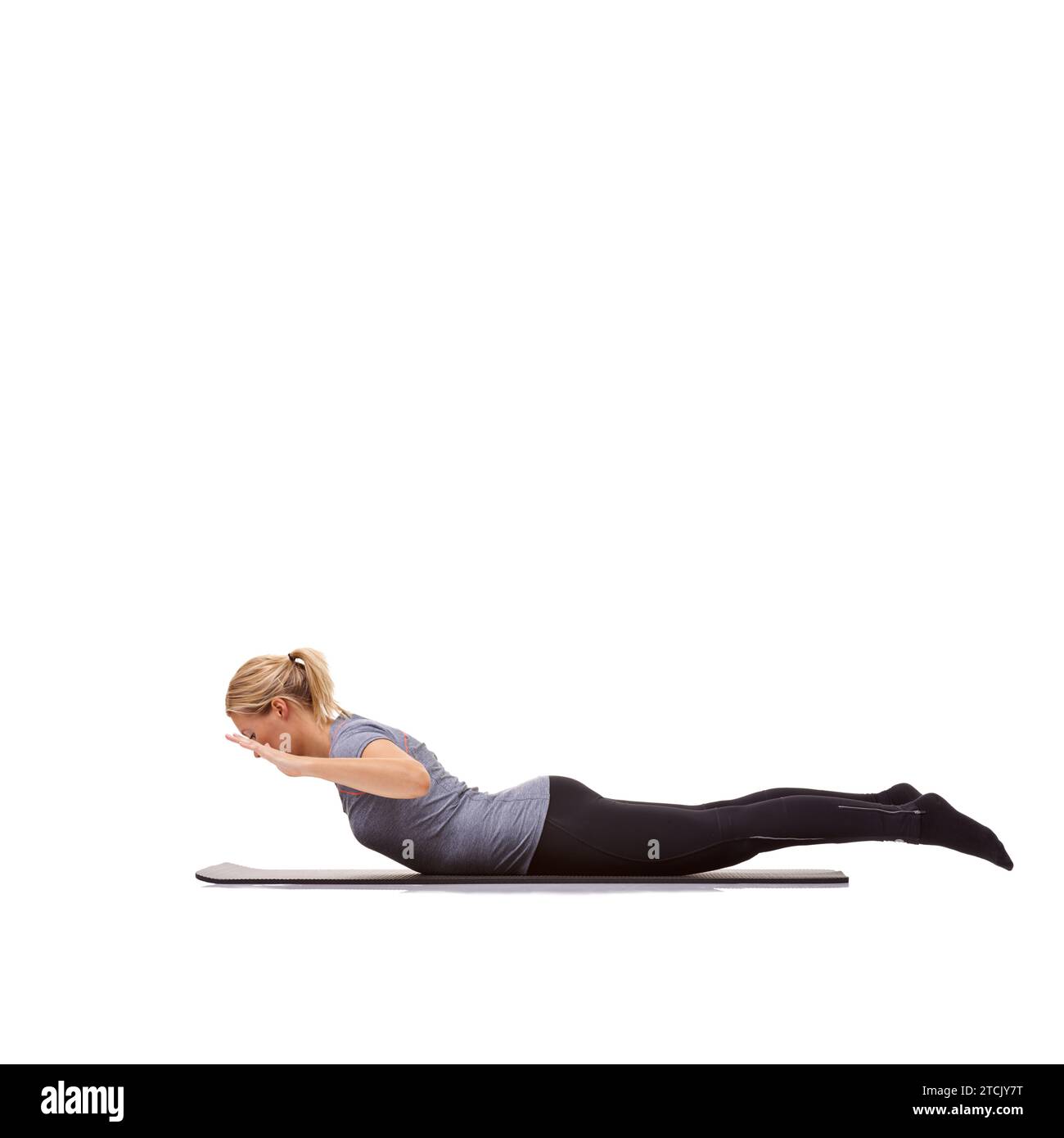 Woman, back extension and yoga exercise in studio for fitness, workout and stretching body on