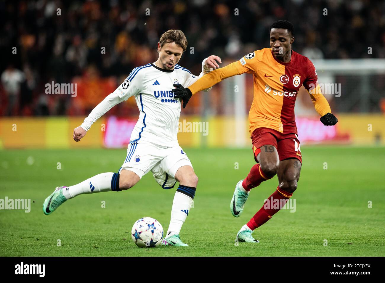 Copenhagen, Denmark. 12th Dec, 2023. Peter Ankersen (22) of FC Copenhagen and Wilfried Zaha (14) of Galatasaray seen during the UEFA Champions League match between FC Copenhagen and Galatasaray at Parken in Copenhagen. (Photo Credit: Gonzales Photo/Alamy Live News Stock Photo