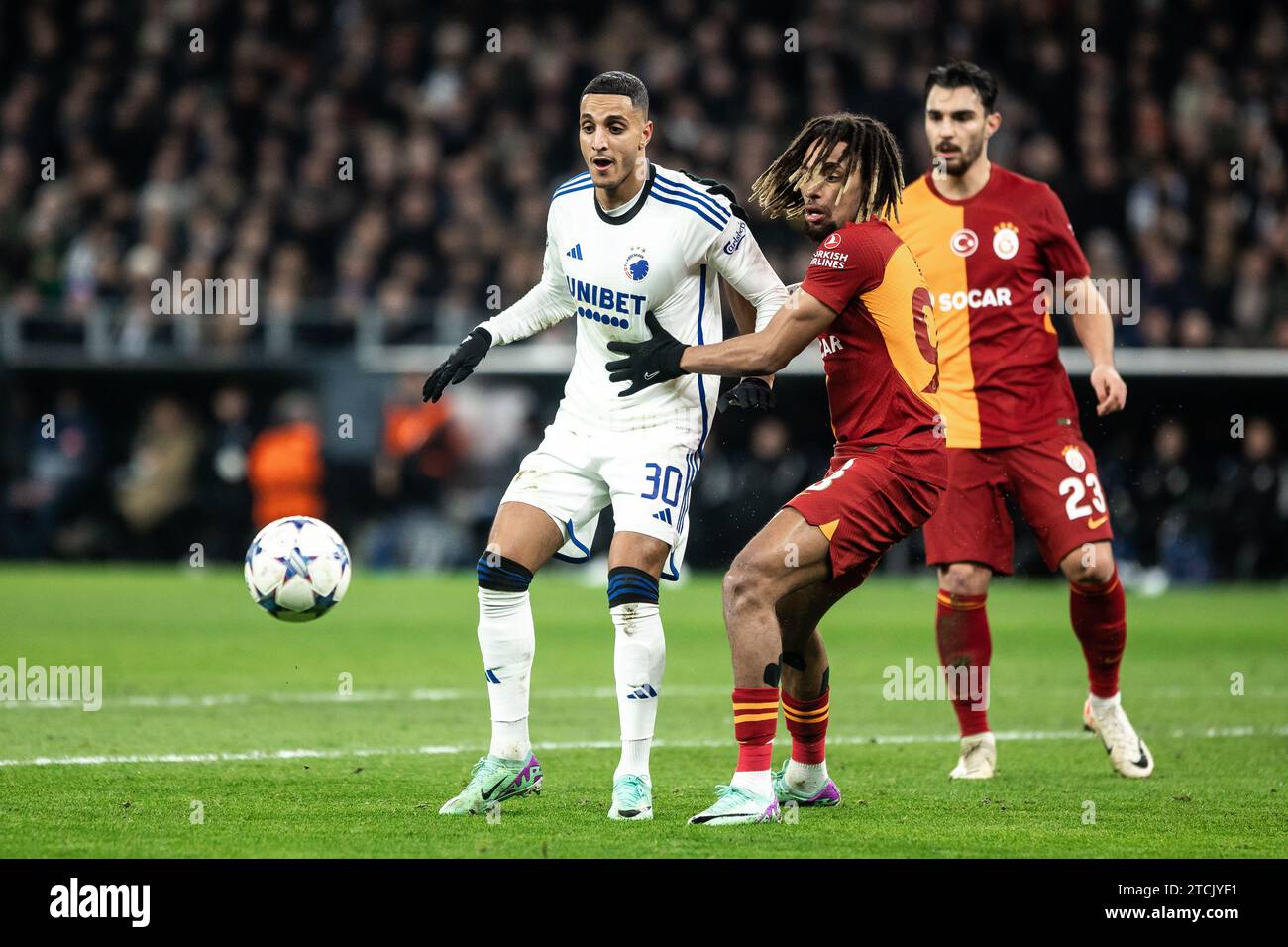 Copenhagen, Denmark. 12th Dec, 2023. Elias Achouri (30) of FC Copenhagen and Sacha Boey (93) of FC Copenhagen seen during the UEFA Champions League match between FC Copenhagen and Galatasaray at Parken in Copenhagen. (Photo Credit: Gonzales Photo/Alamy Live News Stock Photo