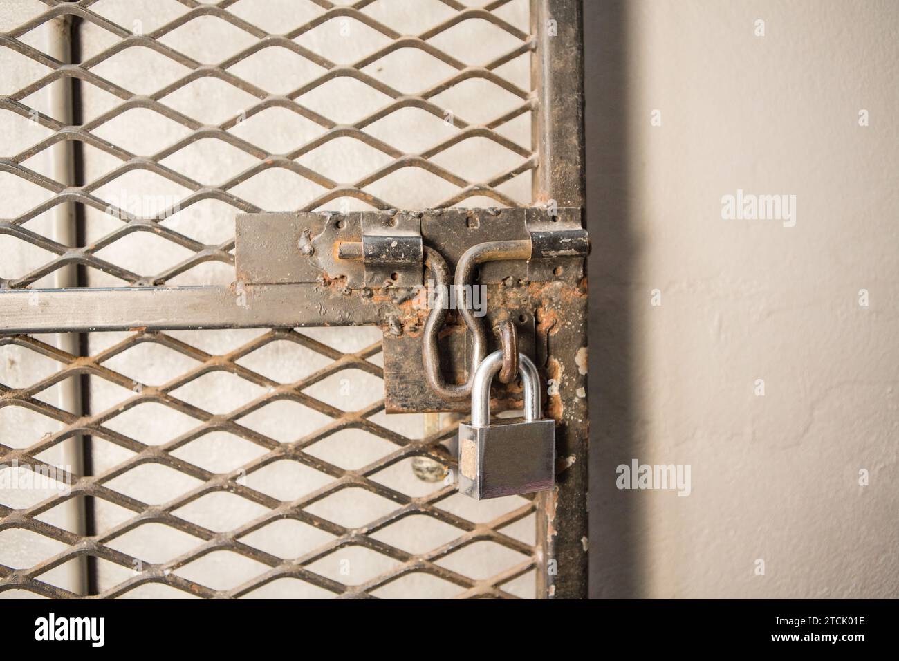 Closeup metal door with lock in grungy style Stock Photo - Alamy