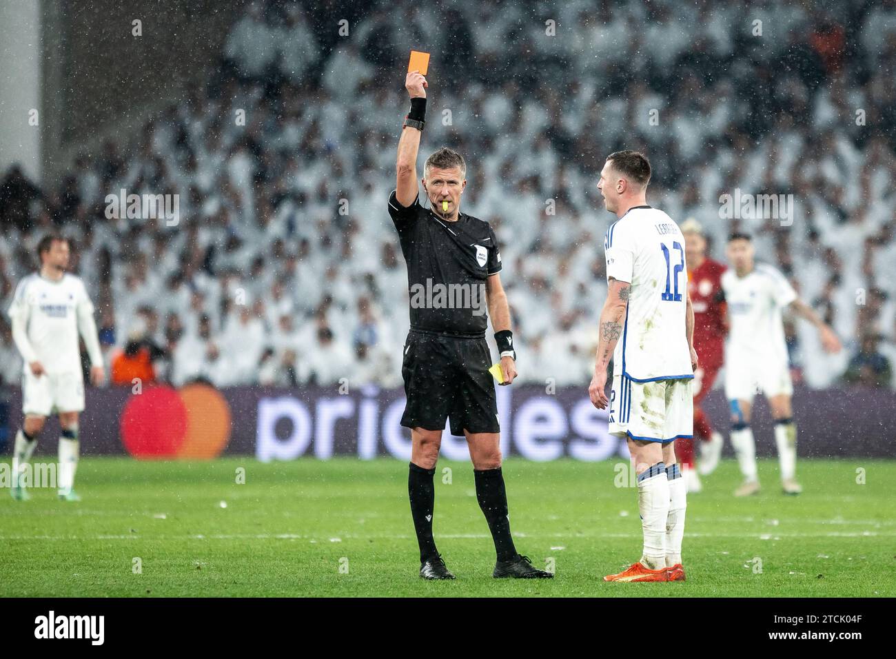 Copenhagen, Denmark. 12th Dec, 2023. Referee Daniele Orsato sends off Lukas Lerager (12) of FC Copenhagen during the UEFA Champions League match between FC Copenhagen and Galatasaray at Parken in Copenhagen. (Photo Credit: Gonzales Photo/Alamy Live News Stock Photo