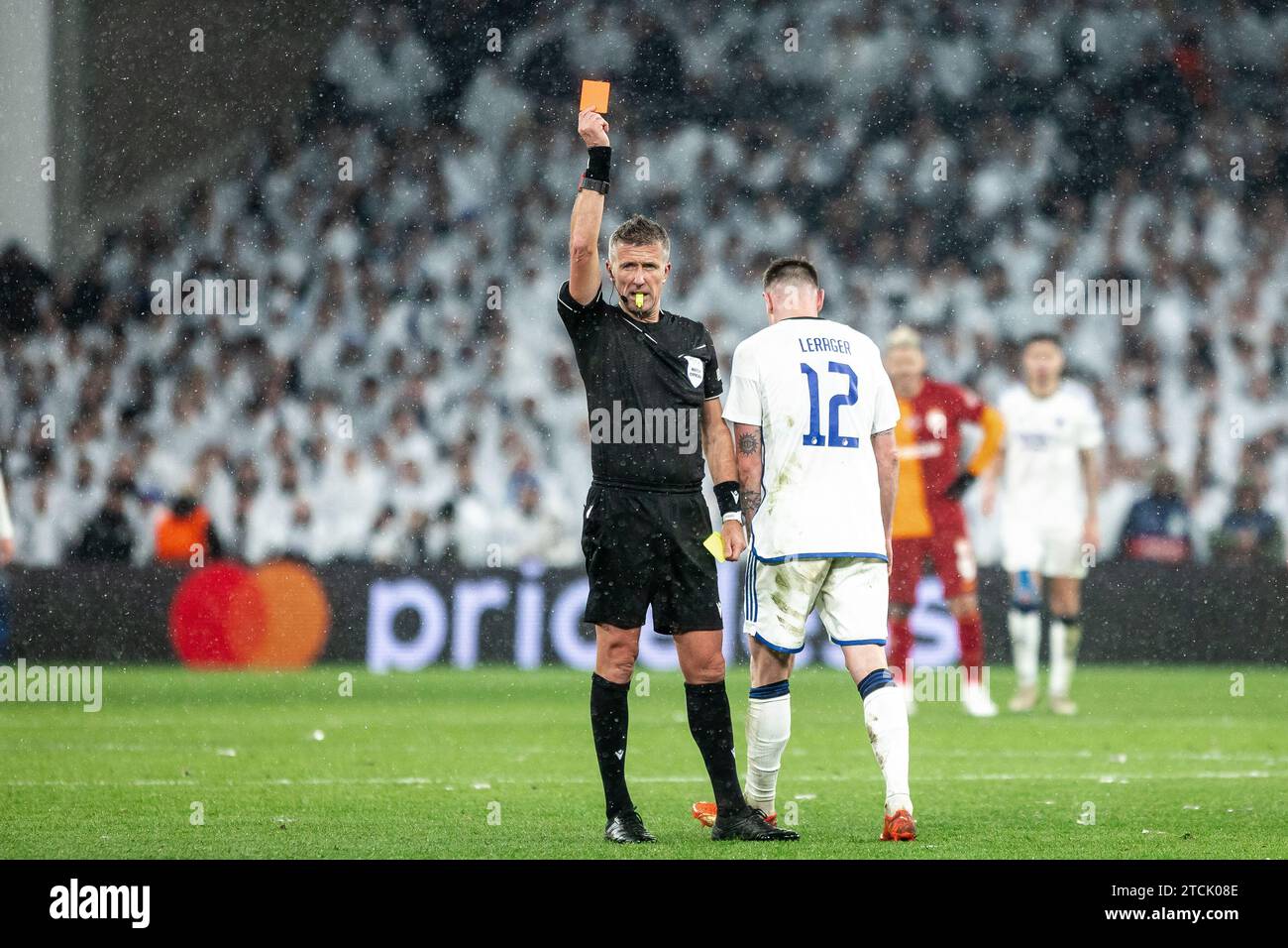 Copenhagen, Denmark. 12th Dec, 2023. Referee Daniele Orsato sends off Lukas Lerager (12) of FC Copenhagen during the UEFA Champions League match between FC Copenhagen and Galatasaray at Parken in Copenhagen. (Photo Credit: Gonzales Photo/Alamy Live News Stock Photo