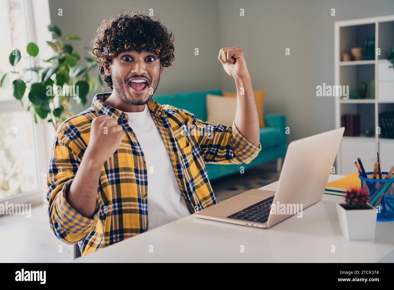 Photo of crazy excited cheerful guy it specialist hacker with raised ...