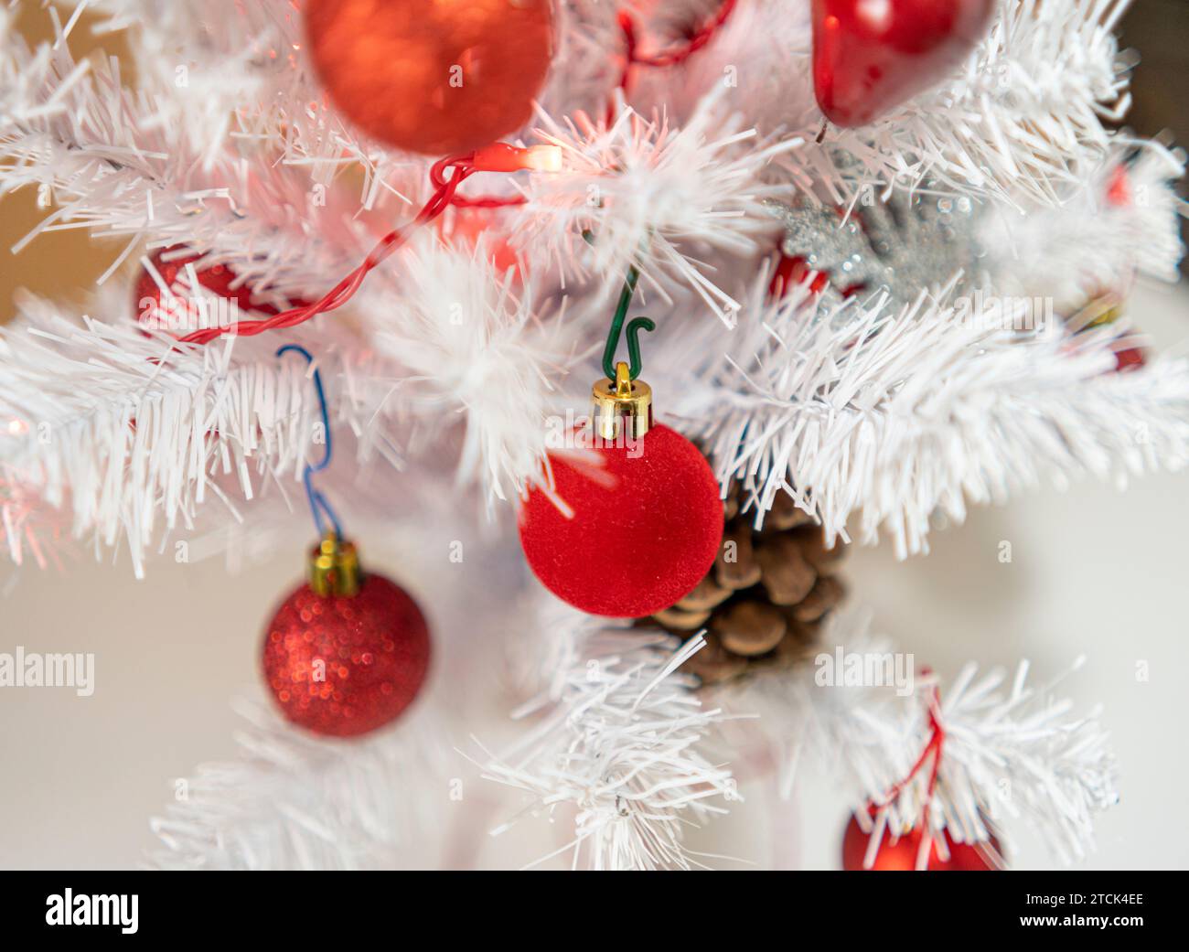 White Christmas tree with red decorations Stock Photo