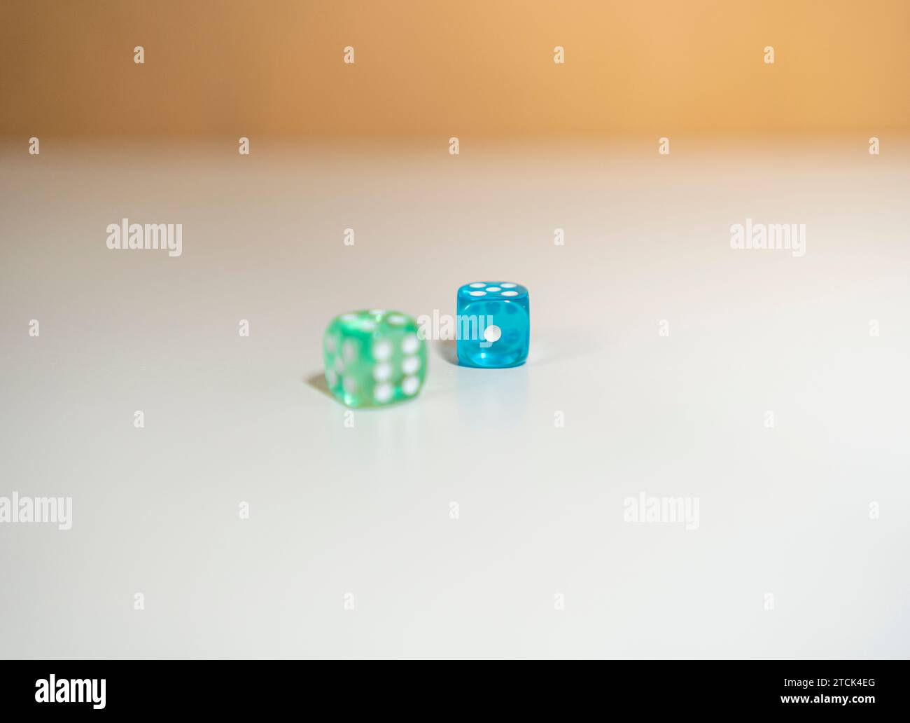 Blue and green dice only one in focus Stock Photo