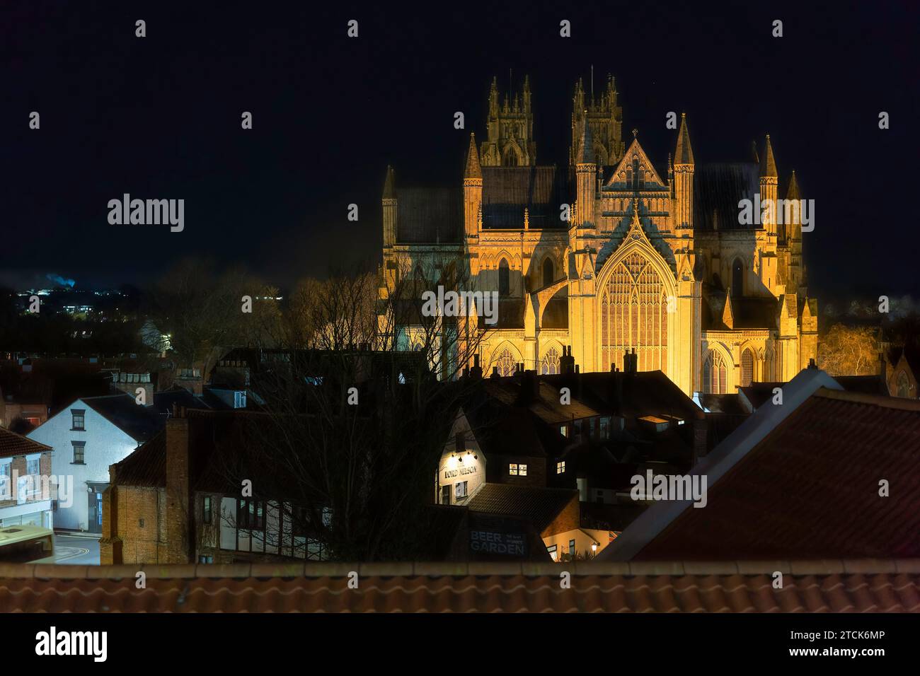 Night time view of ancient minster from elevated point in town centre with flood lights in Beverley, UK. Stock Photo