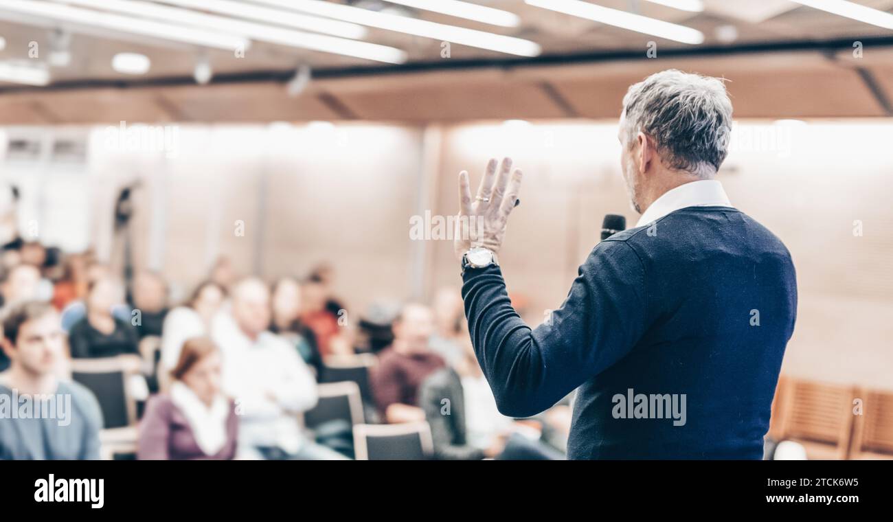 Expert giving a talk on business conference workshop. Unrecognizable ...