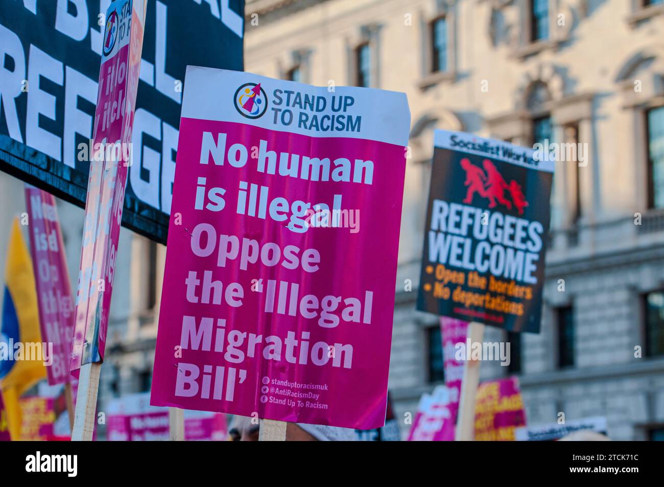 Protesters gather outside Westminster Square in opposition to the Illegal Migration Bill. Including Safe Passage & Stand Up to Racism Stock Photo