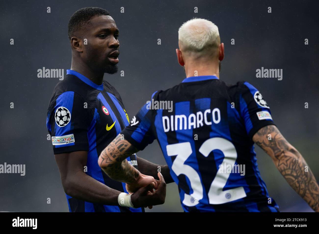 Milan, Italy. 12 December 2023. Marcus Thuram of FC Internazionale speaks with Federico Dimarco of FC Internazionale during the UEFA Champions League football match between FC Internazionale and Real Sociedad. Credit: Nicolò Campo/Alamy Live News Stock Photo