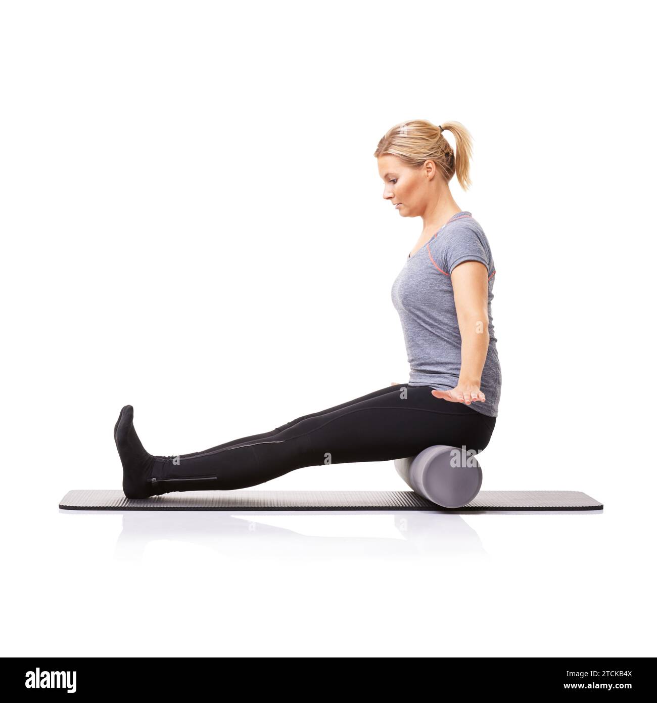 Pilates, foam roller and woman in a studio for exercise, stretching or ...