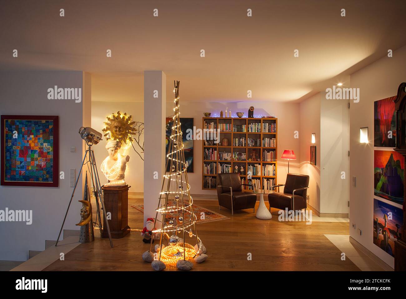 DE - BAVARIA: Contemporary private room setting with lit up minimalistic Christmas tree - Photography and Christmas tree design by owner Edmund Nagele Stock Photo