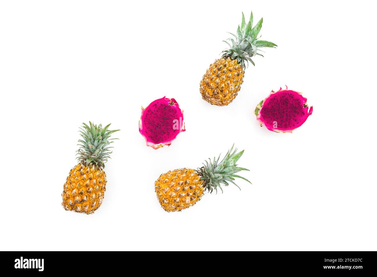 Tropical fruit: pineapple and dragon fruits on white background. Flat lay Stock Photo