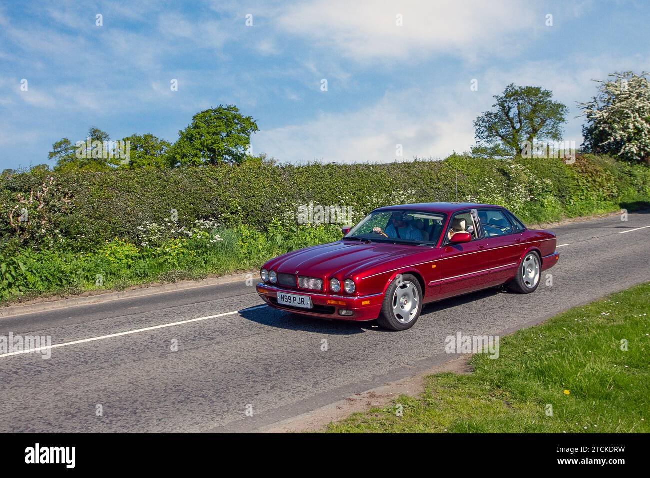 1996 90s nineties Jaguar Xjr Auto V6 S/C SWB Auto Red Car executive Saloon Petrol 3980 cc; Vintage, restored classic motors, automobile collectors motoring enthusiasts, historic veteran cars travelling in Cheshire, UK Stock Photo