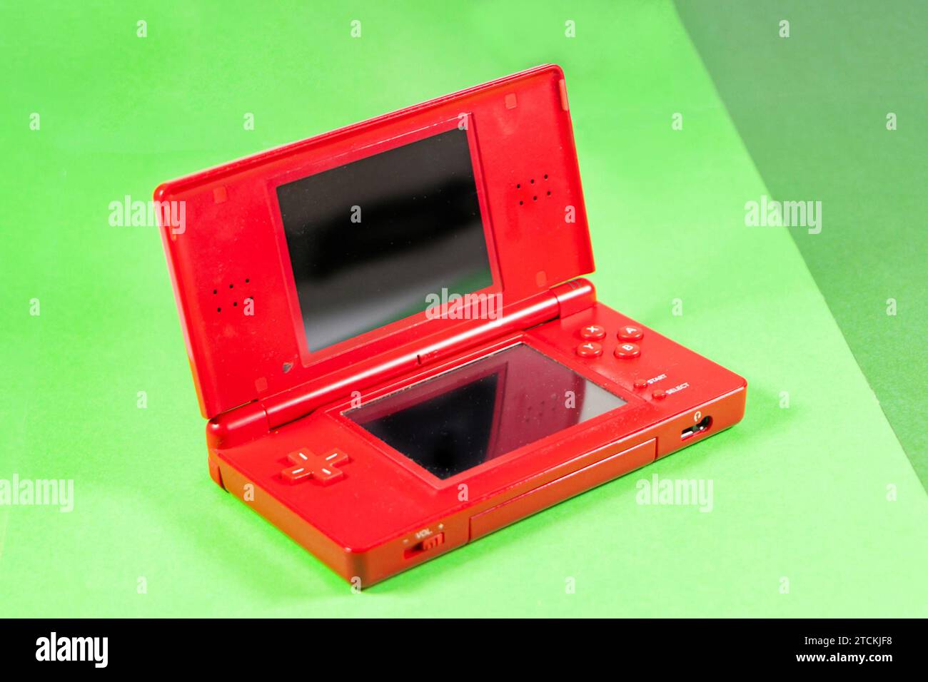 red plastic Nintendo DS lite portable handheld gaming console isolated
