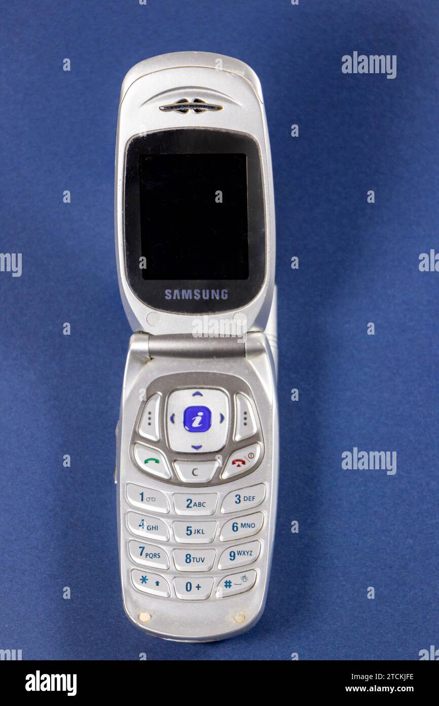 vintage silver samsung Virgin branded flip phone isolated on white