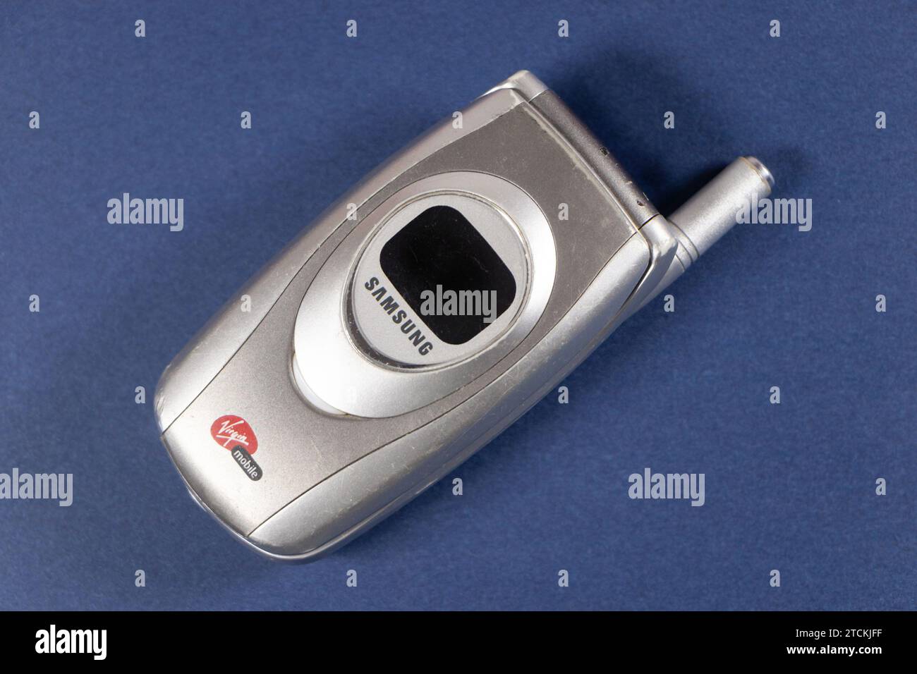 vintage silver samsung Virgin branded flip phone isolated on white