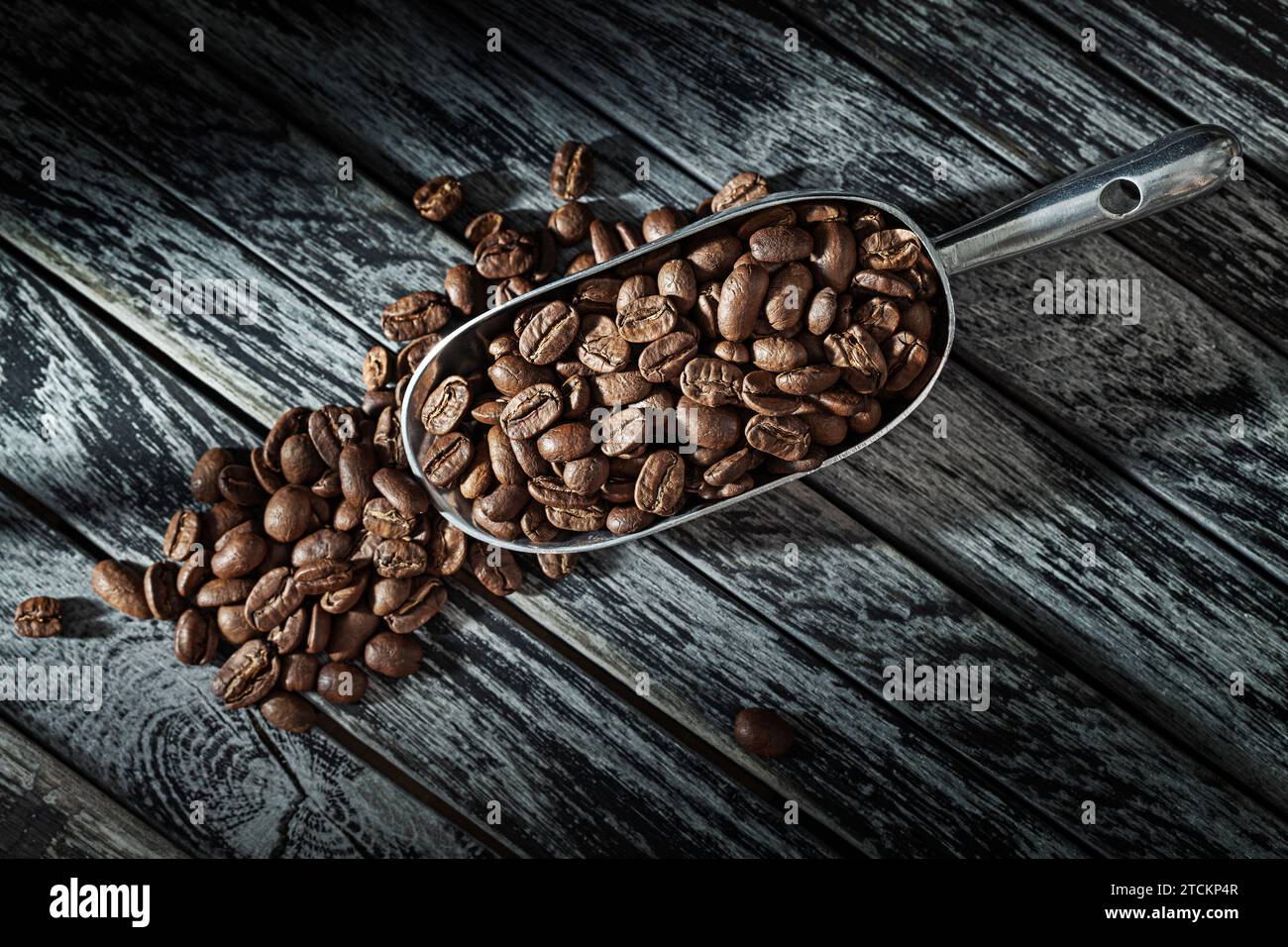 Roasted Coffee Beans And Scoop On Vintage Backgorund Stock Photo