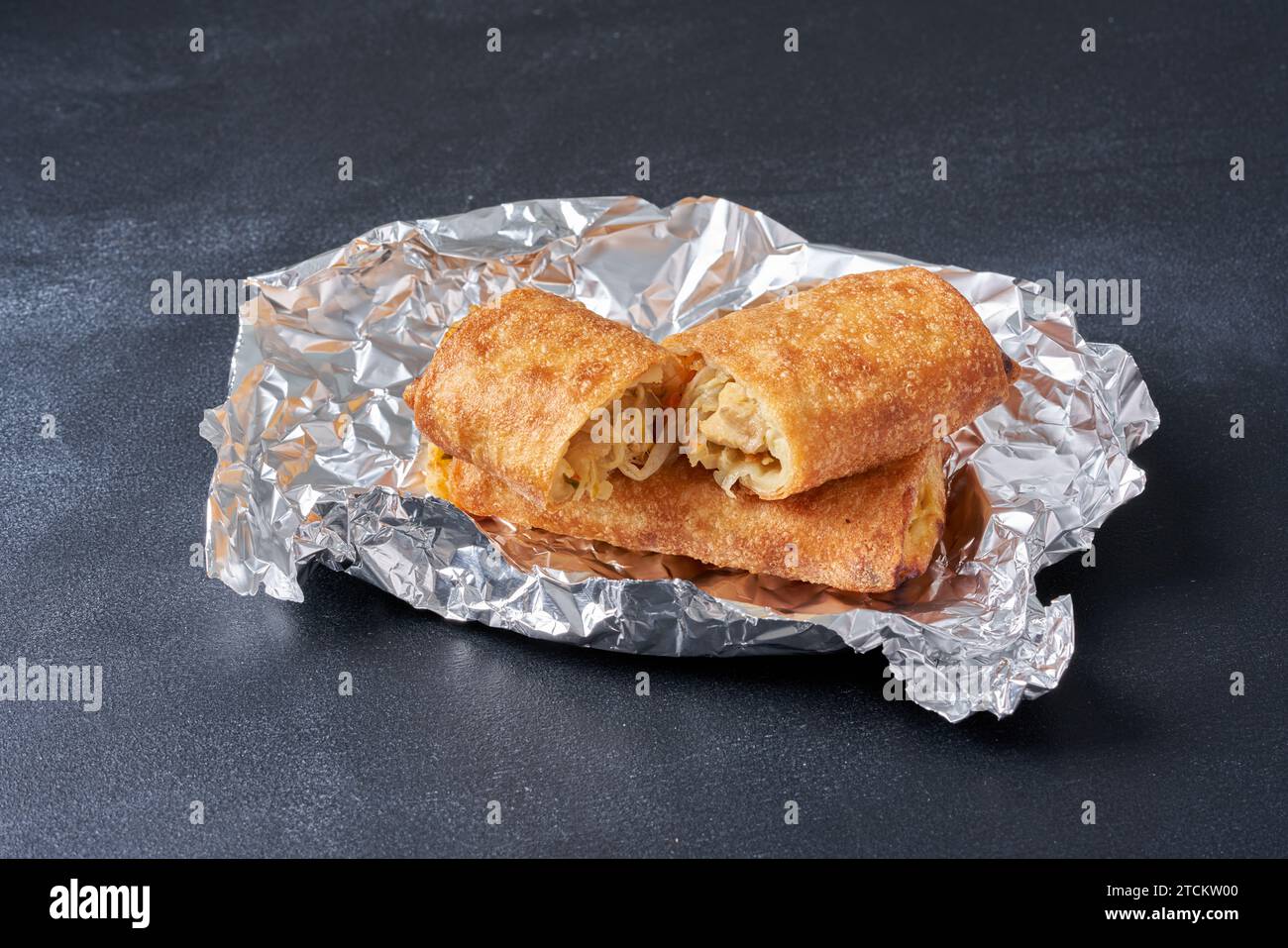 Hot fried spring rolls on a darker background Stock Photo